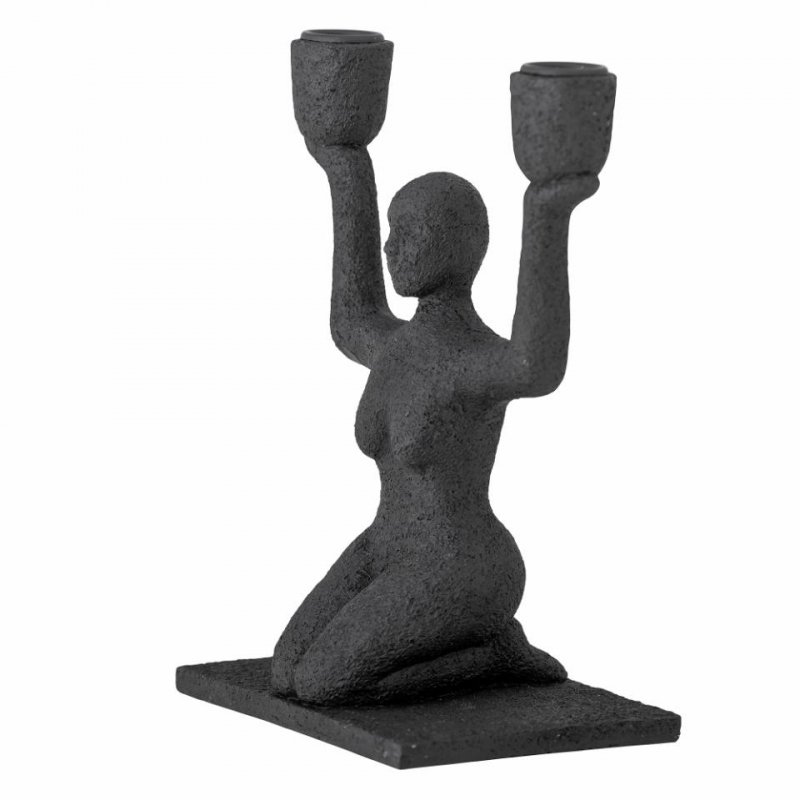 Minimalistyczny świecznik w formie figury kobiety ćwiczącej jogę