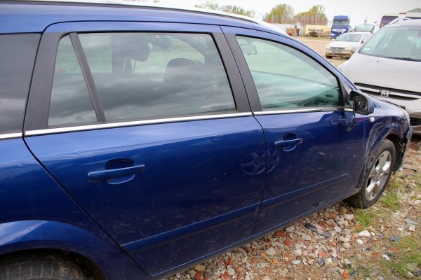 _Zamek drzwi tył lewy Opel Astra H 2005 Kombi 