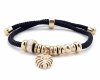 GOLDENES ARMBAND MIT EDELSTAHL