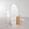 Lustro stojące z drewna dębowego Eriste o owalnym kształcie, stabilna podstawa i elegancki design.