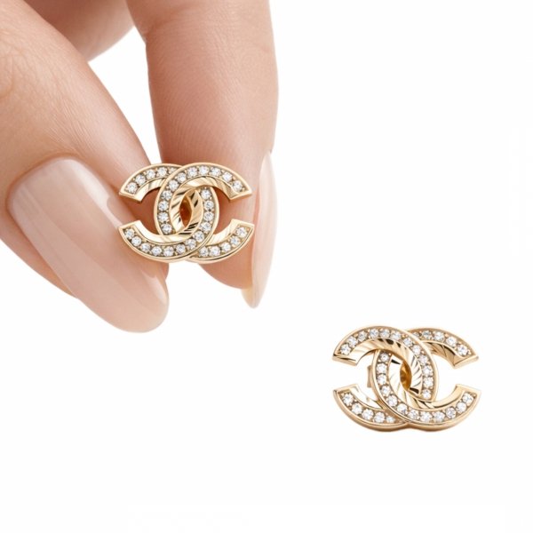 Kolczyki duże splecione litery złoto 585