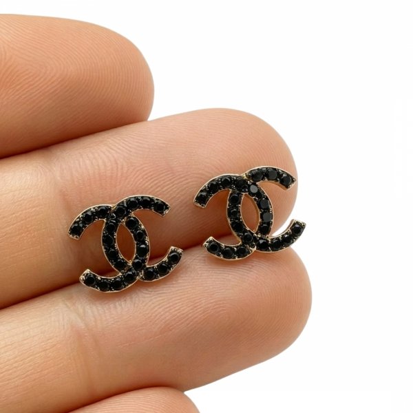 Kolczyki splecione półokręgi z czarnymi kamieniami złoto 585 