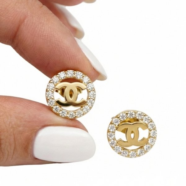 Kolczyki o splecionej formie z białymi kamieniami złoto 585