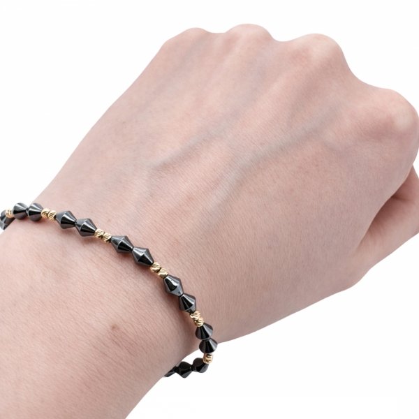 Bransoletka ze złotymi kulami i hematytem złoto 585 