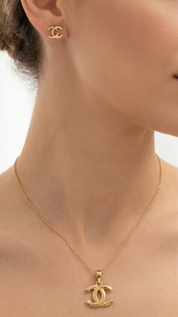 Komplet wisior i kolczyki o splecionej formie liter ze złota 585