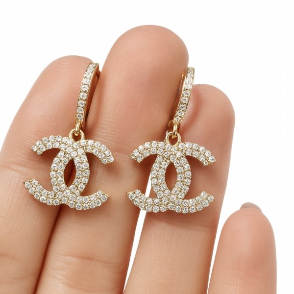 Okazałe kolczyki splecione litery złoto 585