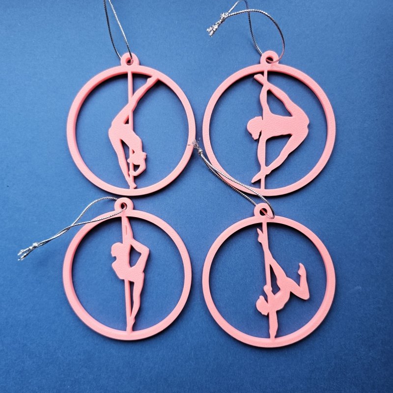 Set of 4 Pink Glow in the Dark Pole Dance Christmas Ornaments displayed together on a blue background. Amira Perun Poledance Decor