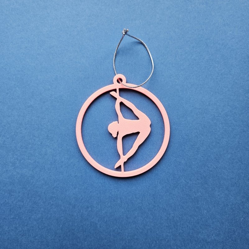 Pink Glow in the Dark Pole Dance Ornament (Pose D) on a blue background. Handmade Christmas Decoration